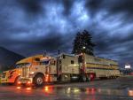 A Displays Fine Art Services tractor trailer in the early morning.