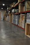 The inside of the Displays Fine Art Services warehouse showing shelfs with art packed in cases on them.